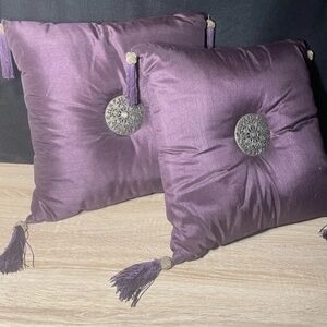 Purple satin boudoir pillows with metal button tuft and tassels